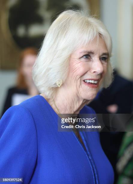 Queen Camilla smiles as she speaks to guests during the Booker Prize Foundation reception at Clarence House on November 23, 2023 in London, England.