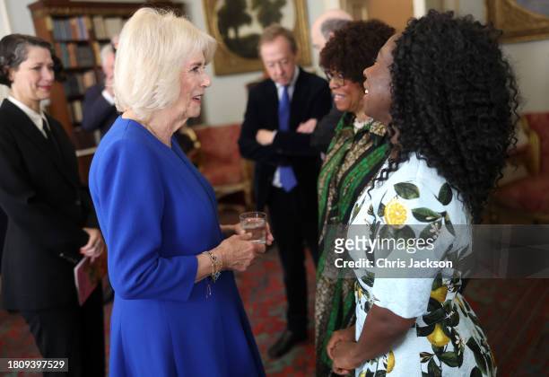 Queen Camilla shares a joke with Esi Edugyan, chair of the 2023 Booker Prize judges during the Booker Prize Foundation reception at Clarence House on...