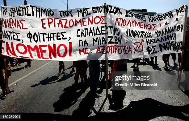 Teachers hold banners during protests against austerity and job cuts on September 18, 2013 in Athens, Greece. As part of the redeployment plan in the...