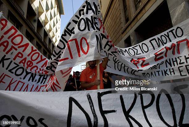 Civil servant protest with banners during a demonstration against austerity and job cuts on September 18, 2013 in Athens, Greece. As part of the...