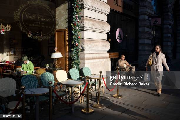 Customers sit inside and outside a 'Caffe Concerto' brasserie on Piccadilly in Westminster, on 28th November 2023, in London, England.