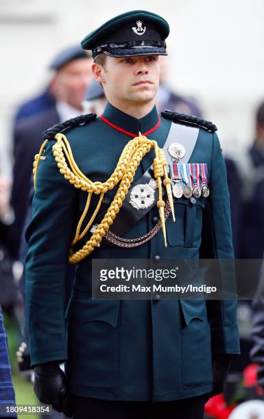 Major Oliver 'Ollie' Plunket accompanies Queen Camilla as she visits the 95th Field of Remembrance at Westminster Abbey on November 9, 2023 in...