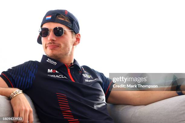 Max Verstappen of the Netherlands and Oracle Red Bull Racing looks on in the Paddock during previews ahead of the F1 Grand Prix of Abu Dhabi at Yas...