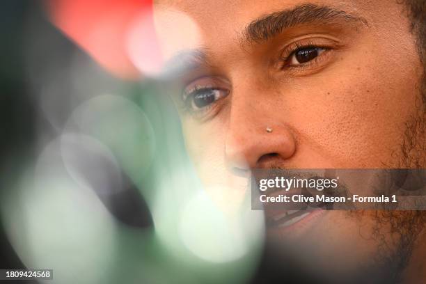 Lewis Hamilton of Great Britain and Mercedes talks to the media in the Paddock during previews ahead of the F1 Grand Prix of Abu Dhabi at Yas Marina...