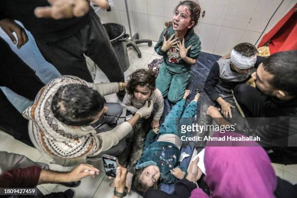 Palestinians injured in Israeli airstrikes arrive at Nasser Medical Hospital on November 23, 2023 in Khan Yunis, Gaza. On Tuesday night, Israel and...