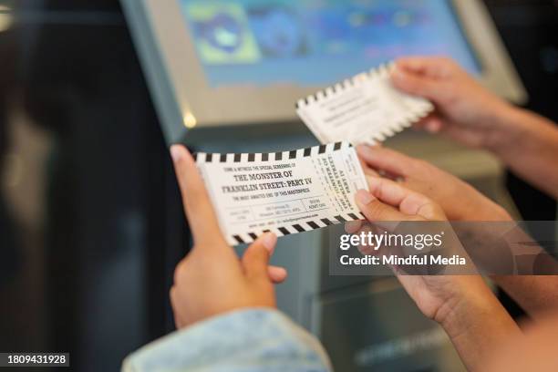 unidentified person's hands holding movie tickets - biljett bildbanksfoton och bilder
