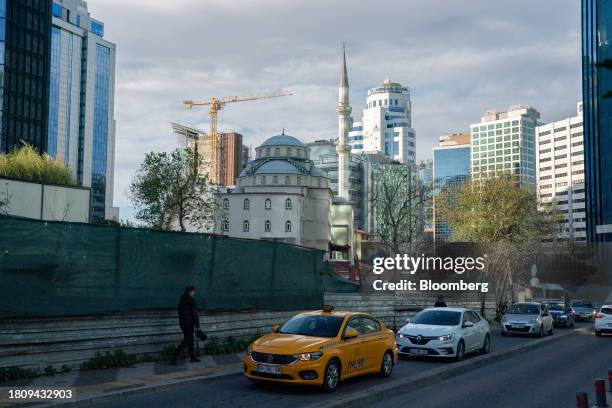 Yellow taxi car drives through the business district in Istanbul, Turkey, on Tuesday, Nov. 28, 2023. Turkey reports GDP figures on 30 Nov....