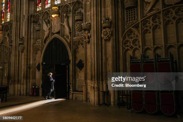 Tour guide at an entrance to King's College Chapel at Cambridge University in Cambridge, UK, on Tuesday, Nov. 28, 2023. The installation of 438 new...