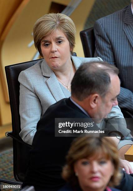 Deputy First Minister Nicola Sturgeon reacts to a comment during a debate at the Scottish Parliament on the future of Scotland on Wednesday September...