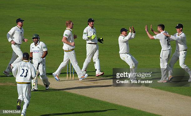 Durham bowler Jamie Harrison celebrates with team mates after taking the wicket of Notts batsman Samit Patel during day two of the LV County...