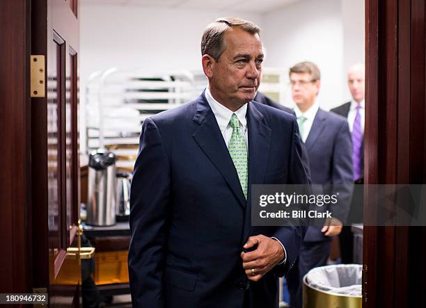 Speaker of the House John Boehner, R-Ohio, leaves the House Republican Conference meeting to address the media in the basement of the Capitol on...