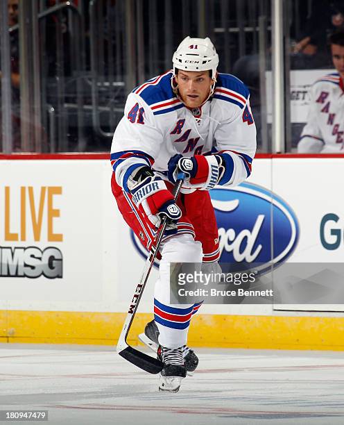 Stu Bickel of the New York Rangers skates against the New Jersey Devils during a preseason game at the Prudential Center on September 16, 2013 in...