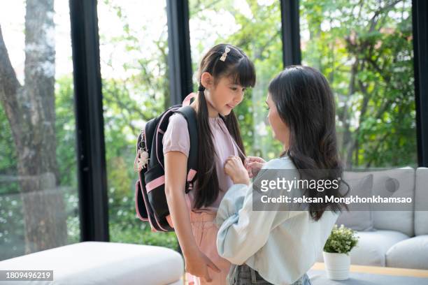 mother preparing her daughter for first day in school - girl making sandwich stock pictures, royalty-free photos & images