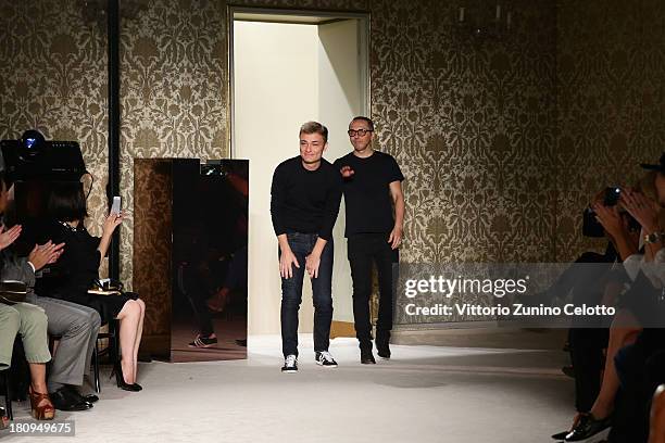 Designers Tommaso Aquilano and Roberto Rimondi acknowledge the applause of the audience after the Fay show as a part of Milan Fashion Week Womenswear...