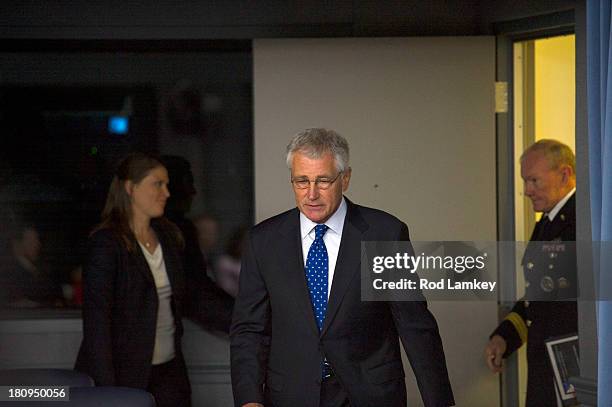 Secretary of Defense Chuck Hagel Chairman of the Joint Chiefs of Staff Gen. Martin E. Dempsey arrive to brief the press at the Pentagon, September...