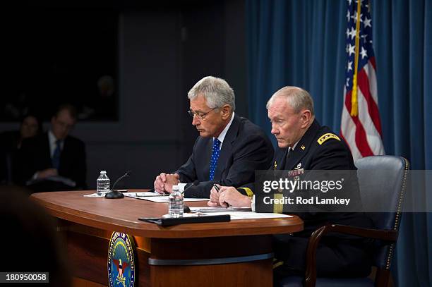 Secretary of Defense Chuck Hagel Chairman of the Joint Chiefs of Staff Gen. Martin E. Dempsey brief the press at the Pentagon, September 18, 2013 in...