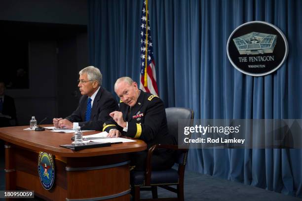 Secretary of Defense Chuck Hagel Chairman of the Joint Chiefs of Staff Gen. Martin E. Dempsey brief the press at the Pentagon, September 18, 2013 in...