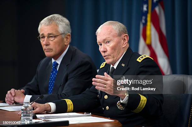 Secretary of Defense Chuck Hagel Chairman of the Joint Chiefs of Staff Gen. Martin E. Dempsey brief the press at the Pentagon, September 18, 2013 in...