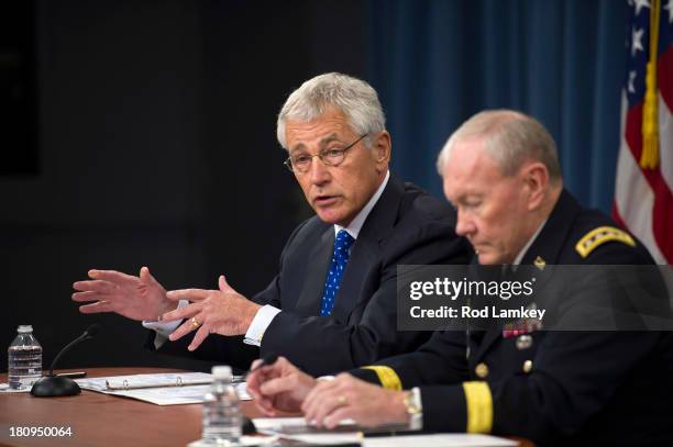 Secretary of Defense Chuck Hagel Chairman of the Joint Chiefs of Staff Gen. Martin E. Dempsey brief the press at the Pentagon, September 18, 2013 in...