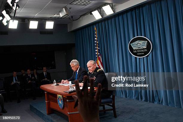 Secretary of Defense Chuck Hagel Chairman of the Joint Chiefs of Staff Gen. Martin E. Dempsey brief the press at the Pentagon, September 18, 2013 in...