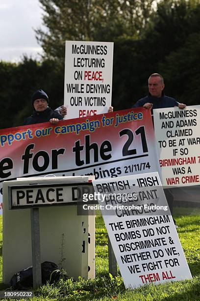 Protesters campaigning for justice for the victims of the Birmingham bombings stand wih placards outside the Tim Parry Johnathan Ball Foundation for...