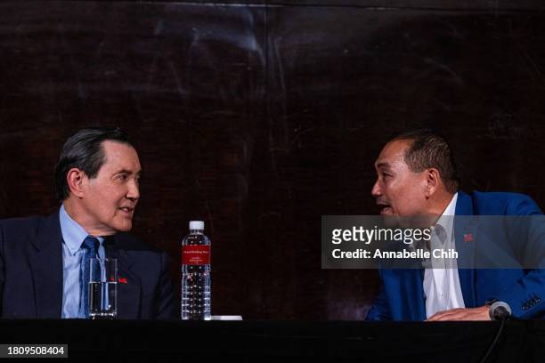 The presidential candidate of Kuomintang , Hou Yu-ih , talks to the Taiwan's former president, Ma Ying-jeou , during a press conference of potential...