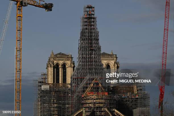This photograph taken on November 29 shows a view of the scaffoldings around the wooden structure of the new spire in place at Notre-Dame de Paris...