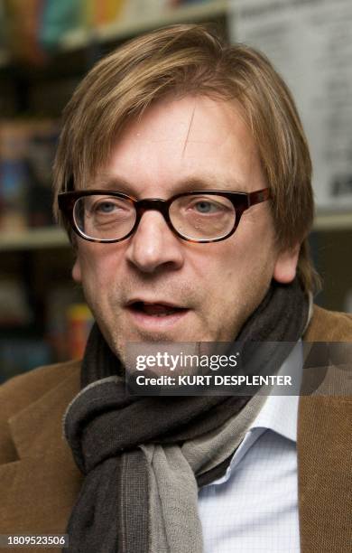 Former Belgian Prime Minister Guy Verhofstadt reads a story for children at the library Brugse Poort in Gent during the Reading breakfast of the Read...