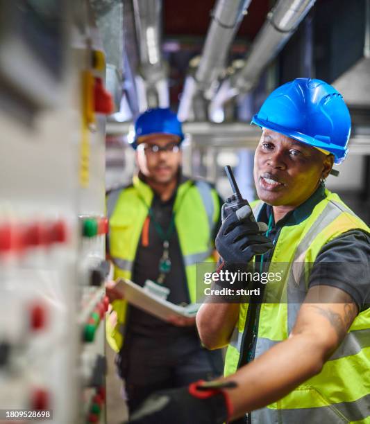 heating engineers in the plant room - engine room stock pictures, royalty-free photos & images