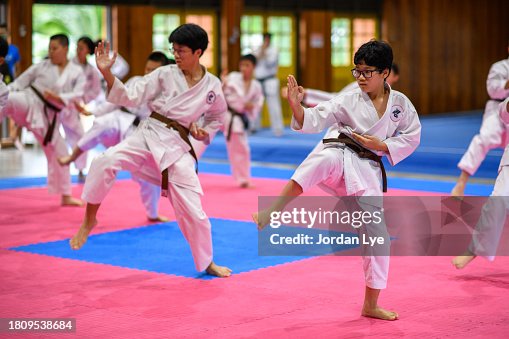 Karate students practicing during a karate class Karate students practicing during a karate class