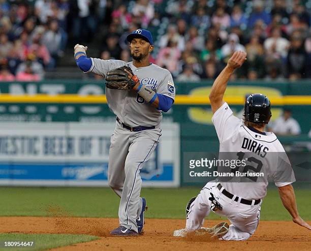 Second baseman Emilio Bonifacio of the Kansas City Royals turns the ball after getting a force out on Andy Dirks of the Detroit Tigers in the second...