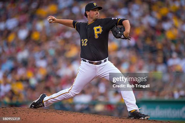 Vin Mazzaro of the Pittsburgh Pirates pitches during game one of a twilight doubleheader against the St. Louis Cardinals at PNC Park on July 30, 2013...