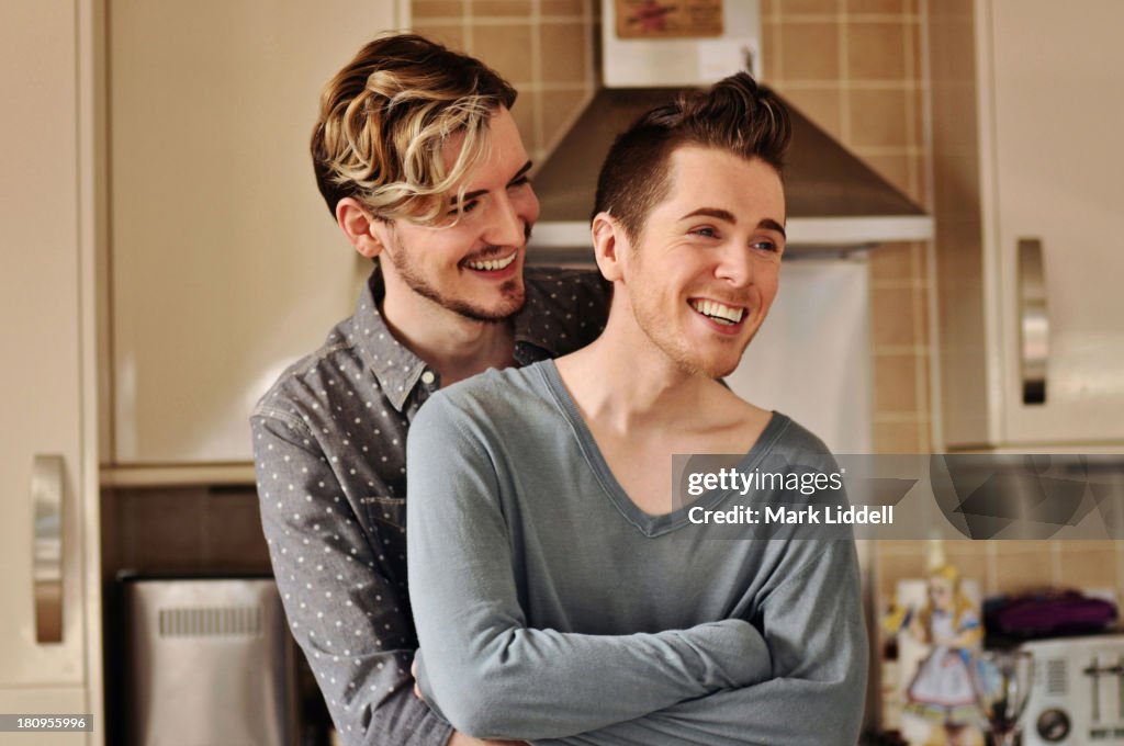 Happy gay couple hugging