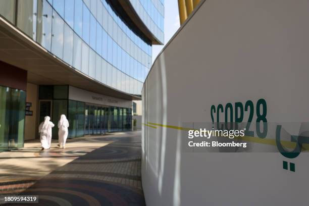 Branded hoarding in the Blue Zone ahead of the COP28 climate conference at Expo City in Dubai, United Arab Emirates, on Wednesday, Nov. 29, 2023....