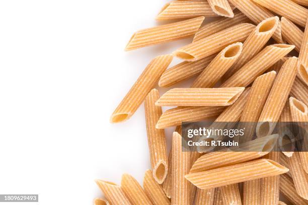 wholegrain penne pasta - vollkorn stock pictures, royalty-free photos & images