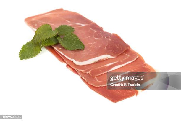 closeup on a piece of spanish serrano ham - cure 2013 stock pictures, royalty-free photos & images