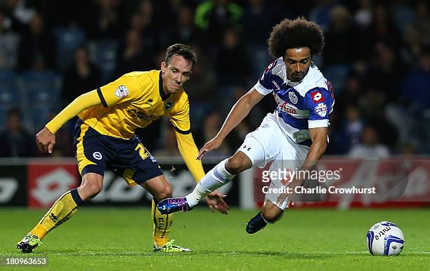 David Lopez of Brighton fouls Benoit Assou-Ekotto of QPR during the Sky Bet Championship match between Queens Park Rangers and Brighton & Hove Albion...