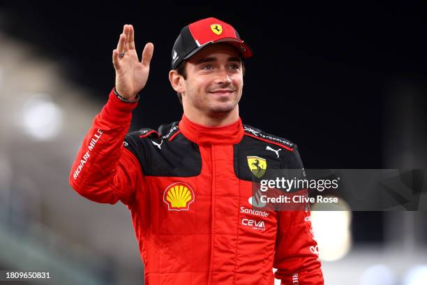 Charles Leclerc of Monaco and Ferrari looks on at the Ferrari Team Photo during previews ahead of the F1 Grand Prix of Abu Dhabi at Yas Marina...