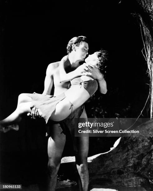 Johnny Weissmuller , as Tarzan, and Maureen O'Sullivan as Jane Parker, in a promotional portrait for 'Tarzan and His Mate', directed by Cedric...