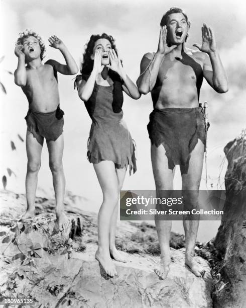 Johnny Sheffield , as Boy, Maureen O'Sullivan as Jane Parker, and Johnny Weissmuller as Tarzan, in a promotional still for 'Tarzan's Secret...