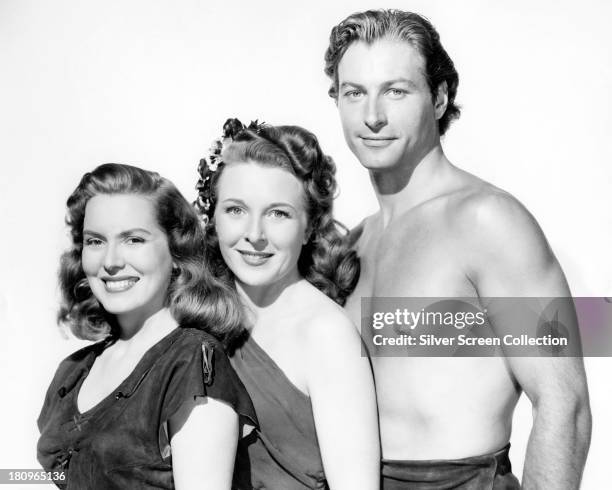 Brenda Joyce as Jane, Evelyn Ankers as Gloria James Jessup, and Lex Barker as Tarzan, in a promotional portrait for 'Tarzan's Magic Fountain',...