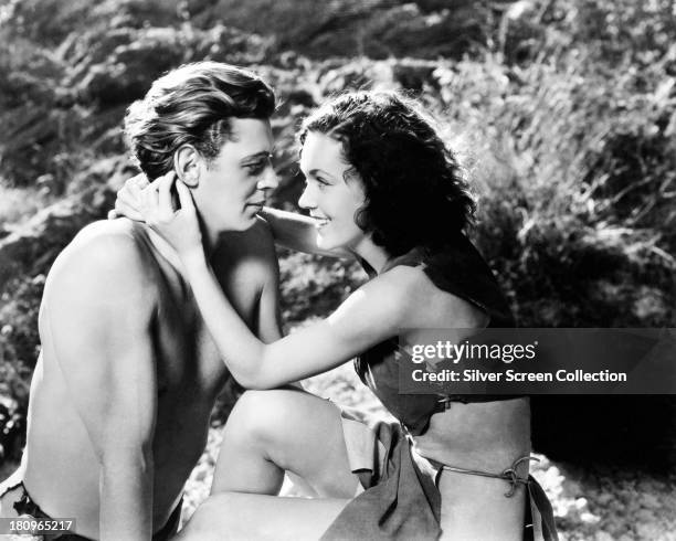 Johnny Weissmuller , as Tarzan, and Maureen O'Sullivan as Jane Parker, in a promotional portrait for 'Tarzan and His Mate', directed by Cedric...