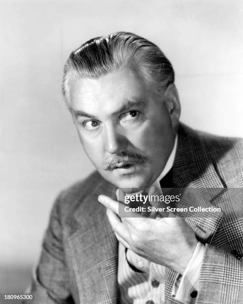 British actor Nigel Bruce , as Doctor Watson, in a promotional portrait for one of the fourteen films in which he played the role, circa 1942.
