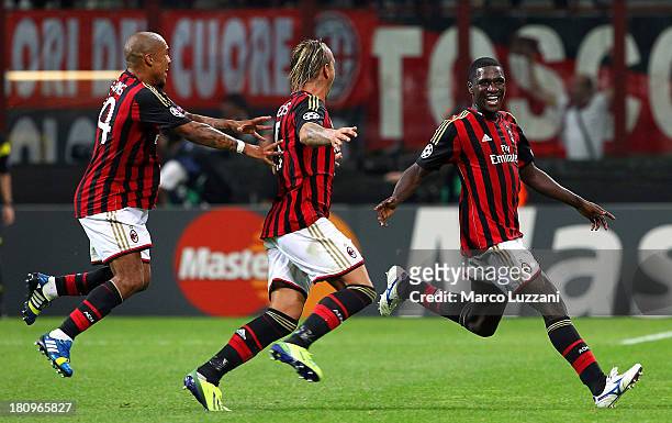 Cristian Zapata of AC Milan celebrates with his team-mates Philippe Mexes and Nigel De Jong after scoring the opening goal during the UEFA Champions...