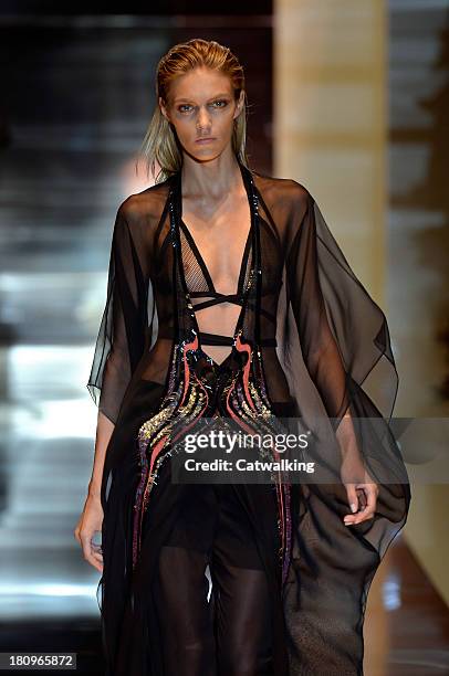 Model walks the runway at the Gucci Spring Summer 2014 fashion show during Milan Fashion Week on September 18, 2013 in Milan, Italy.