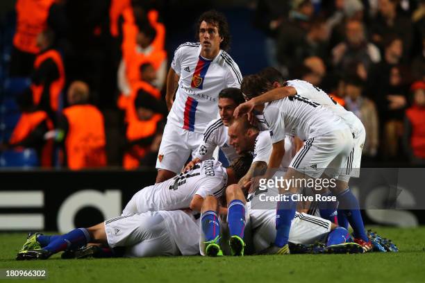 Marco Streller of FC Basel celebrates scoring their second goal with team mates during the UEFA Champions League Group E Match between Chelsea and FC...
