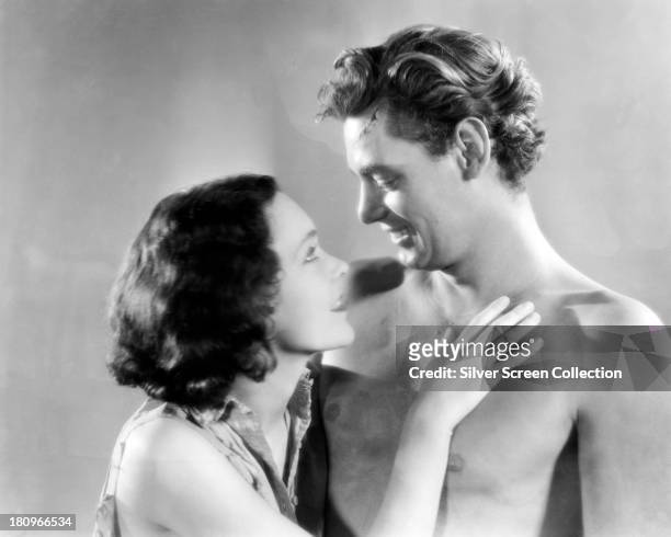 Johnny Weissmuller , as Tarzan, and Maureen O'Sullivan as Jane Parker, in a promotional portrait for 'Tarzan The Ape Man', directed by W. S. Van...