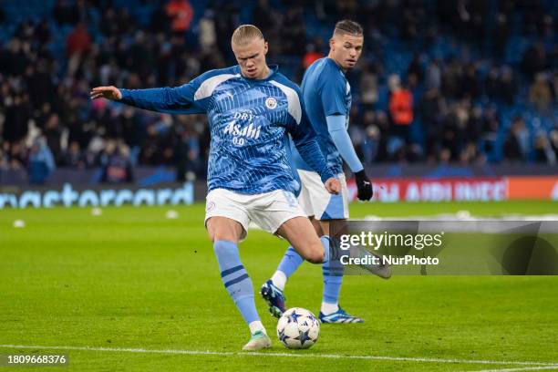 Erling Haaland, wearing the number 9 jersey for Manchester City, is warming up before the match during the UEFA Champions League, Group G match...