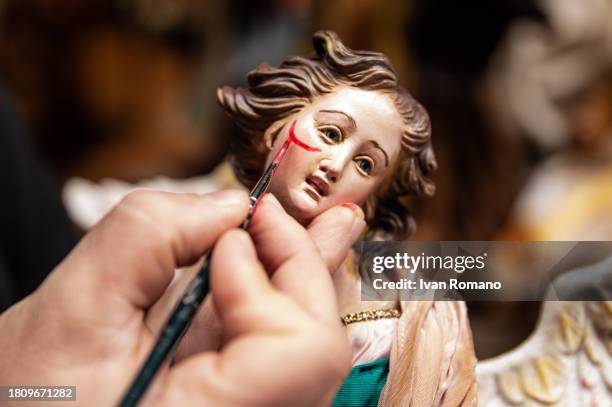 The shepherds of the nativity scene of San Gregorio Armeno, painted with the red mustache in support against violence toward women on November 23,...