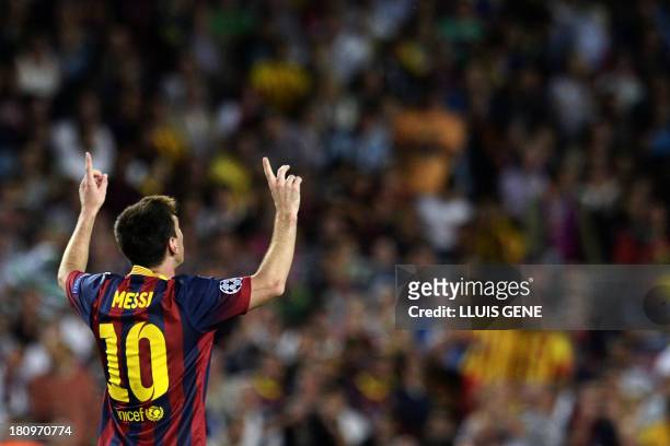Barcelona's Argentinian forward Lionel Messi celebrates after scoring during the UEFA Champions league football match FC Barcelona vs Ajax Amsterdam...